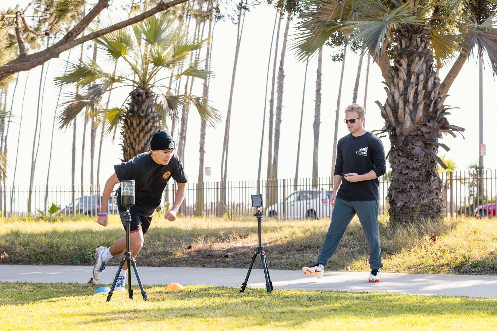 Athlete sprinting through timing gates